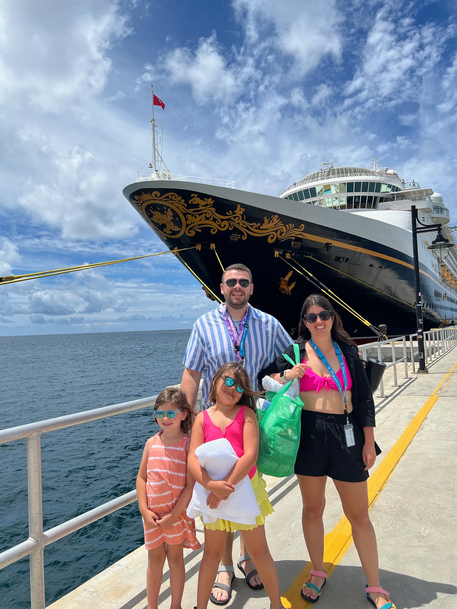 Disney Cruise Line ship at port with family